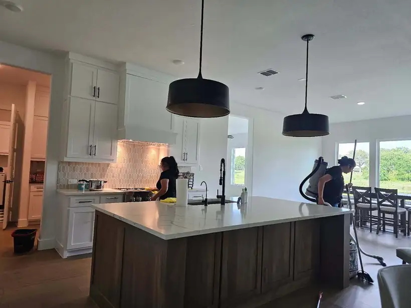 Cleaner working in a kitchen